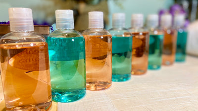 alternating pink and blue bottles of vegan plant based shower gel
